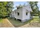 Home featuring wood siding, multiple windows, a front porch, and a brick foundation at 2373 Sorentrue Ave, North Charleston, SC 29405