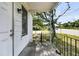 The home features a cozy front porch with black wrought iron railings and a clear view of the surrounding neighborhood at 2373 Sorentrue Ave, North Charleston, SC 29405