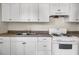 Kitchen featuring white cabinets, appliances, and a double basin sink at 2373 Sorentrue Ave, North Charleston, SC 29405