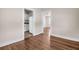 Spacious living room with hardwood floors showing entry to kitchen at 2373 Sorentrue Ave, North Charleston, SC 29405
