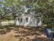 View of the house's back exterior, surrounded by trees and providing a sense of privacy at 2373 Sorentrue Ave, North Charleston, SC 29405