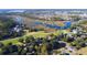 Wide aerial shot of a golf course community along the water featuring landscaping, river, and trees at 2402 Brackish Dr, Mount Pleasant, SC 29466