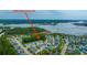 An aerial view shows the townhouse community and surrounding area along the water and marshlands at 2402 Brackish Dr, Mount Pleasant, SC 29466