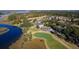 Aerial view of a golf course community showing the building exteriors, landscaping, and water features at 2402 Brackish Dr, Mount Pleasant, SC 29466