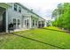 Spacious backyard featuring lush green grass and views of the surrounding wooded area, perfect for outdoor enjoyment at 2402 Brackish Dr, Mount Pleasant, SC 29466