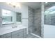 Modern bathroom with gray vanity, bright lighting, and a walk-in shower at 2402 Brackish Dr, Mount Pleasant, SC 29466