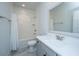 This stylish bathroom features a bathtub with shower, gray vanity with a sink, and modern fixtures at 2402 Brackish Dr, Mount Pleasant, SC 29466