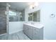 Bathroom with gray vanity, modern fixtures, and tiled shower with glass enclosure at 2402 Brackish Dr, Mount Pleasant, SC 29466