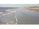 Calm beach scene with gentle waves washing ashore, offering a serene and peaceful coastal experience at 2402 Brackish Dr, Mount Pleasant, SC 29466