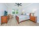 Comfortable bedroom features a full bed, ceiling fan, and lots of natural light at 2402 Brackish Dr, Mount Pleasant, SC 29466