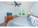 Bright bedroom with a queen bed, television, ceiling fan, and a view outside at 2402 Brackish Dr, Mount Pleasant, SC 29466