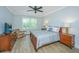 Comfortable bedroom features a full bed, ceiling fan, and lots of natural light at 2402 Brackish Dr, Mount Pleasant, SC 29466