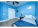 This bedroom features light blue walls, a ceiling fan, and a bed with white bedding and a blue blanket at 2402 Brackish Dr, Mount Pleasant, SC 29466