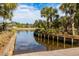 Community boat ramp with dock, palm trees, and landscape overlooking the water at 2402 Brackish Dr, Mount Pleasant, SC 29466