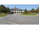 Exterior image showcasing a Clubhouse, featuring a circular driveway and landscaping with a cupola on the roof at 2402 Brackish Dr, Mount Pleasant, SC 29466