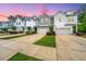 Charming row of townhomes featuring varied architectural styles and well-manicured landscaping at 2402 Brackish Dr, Mount Pleasant, SC 29466