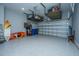 Spacious garage featuring epoxy flooring and overhead storage racks for optimal organization and storage solutions at 2402 Brackish Dr, Mount Pleasant, SC 29466