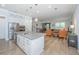 Bright and open kitchen with a large island, stainless steel appliances, and views into the adjacent living space at 2402 Brackish Dr, Mount Pleasant, SC 29466