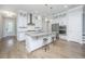 Bright kitchen with white cabinets, granite countertops, stainless steel appliances, and a large island at 2402 Brackish Dr, Mount Pleasant, SC 29466