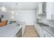 Modern kitchen featuring stainless steel appliances and granite countertops with access to the living area at 2402 Brackish Dr, Mount Pleasant, SC 29466