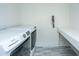 This laundry room features a washer and dryer with a white countertop folding space at 2402 Brackish Dr, Mount Pleasant, SC 29466