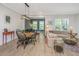 Open-concept living room with dining area and adjacent living room filled with lots of natural light at 2402 Brackish Dr, Mount Pleasant, SC 29466