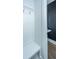 Mudroom with white bench seating, coat hooks and a view of a powder room at 2402 Brackish Dr, Mount Pleasant, SC 29466