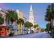 Charming street view with historic buildings, palm trees, and a prominent church steeple in the background at 2402 Brackish Dr, Mount Pleasant, SC 29466