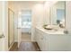 Bright bathroom features a double vanity, wood grain floors, and a shower with sliding doors at 261 Watersglen Dr, Summerville, SC 29486