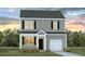 Charming two-story home featuring a well-maintained lawn, a one car garage and a welcoming front entrance at 261 Watersglen Dr, Summerville, SC 29486