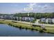 Aerial view of 2931 Waterleaf Rd shows lakeside homes, walking path, and lush greenery at 2931 Waterleaf Rd, Johns Island, SC 29455