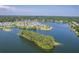 Panoramic aerial view of a community nestled around a serene lake with lush greenery at 2931 Waterleaf Rd, Johns Island, SC 29455
