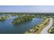 Panoramic aerial view of a serene lake surrounded by residential homes and lush green landscapes at 2931 Waterleaf Rd, Johns Island, SC 29455
