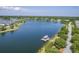 Aerial view of lakeside community with pier, perfect for boating and enjoying scenic views at 2931 Waterleaf Rd, Johns Island, SC 29455