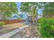 Large backyard with a screened porch, dining set, grill, and fenced yard at 2931 Waterleaf Rd, Johns Island, SC 29455