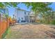 Spacious backyard with a screened porch, grill, dining set, and fenced yard at 2931 Waterleaf Rd, Johns Island, SC 29455