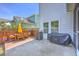 Relaxing backyard space featuring a wooden deck, outdoor dining set, grill, and blue skies at 2931 Waterleaf Rd, Johns Island, SC 29455