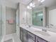 A bathroom featuring a double sink vanity, a large mirror, and a shower at 2931 Waterleaf Rd, Johns Island, SC 29455