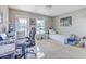 Bedroom featuring a work desk, a bed and a door leading to a balcony at 2931 Waterleaf Rd, Johns Island, SC 29455