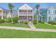 Charming two-story brick home with double balconies, lush landscaping, and sidewalk appeal at 2931 Waterleaf Rd, Johns Island, SC 29455