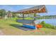 Waterfront kayak storage provides easy lake access for recreational activities in a picturesque setting at 2931 Waterleaf Rd, Johns Island, SC 29455