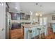 Spacious kitchen with granite counters, stainless appliances, and a breakfast bar overlooking the living area at 2931 Waterleaf Rd, Johns Island, SC 29455