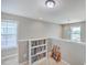 Bright loft area with a bookcase, guitars, and lots of natural light at 2931 Waterleaf Rd, Johns Island, SC 29455