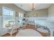 Well-lit home office with large windows, piano, and functional layout at 2931 Waterleaf Rd, Johns Island, SC 29455