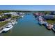 An aerial view showcases a bustling waterfront with boats docked, shops, and restaurants along the waterway at 301 Center St, Mount Pleasant, SC 29464