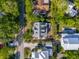Aerial view of a neighborhood, showcasing a home with a grey roof, a pool, and mature landscaping at 301 Center St, Mount Pleasant, SC 29464