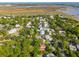 An aerial view showcasing a neighborhood with lush trees and marshland in the background at 301 Center St, Mount Pleasant, SC 29464