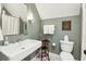 Stylish bathroom with an antique vanity and modern fixtures at 301 Center St, Mount Pleasant, SC 29464