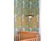 Charming bedroom detail featuring stylish wallpaper and a wooden crib at 301 Center St, Mount Pleasant, SC 29464