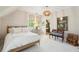 Bright bedroom showcasing a bed, ample natural light, and stylish accents at 301 Center St, Mount Pleasant, SC 29464